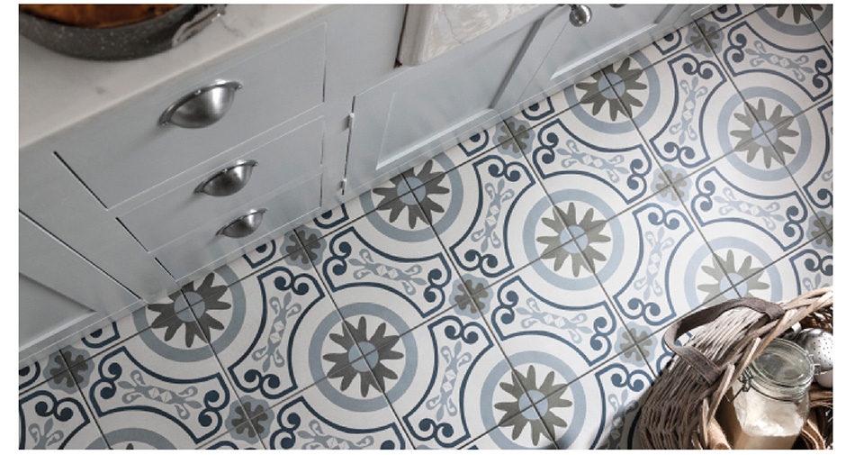 Havana patterned tiles on kitchen floor with white units.