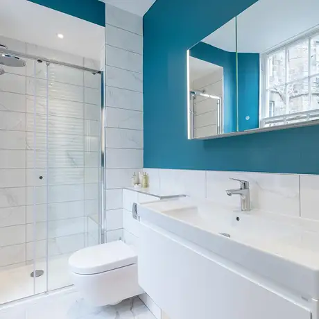 Teal and white marble bathroom