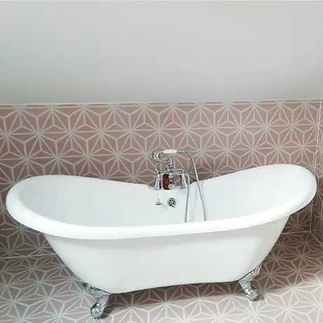 Freestanding bath with Varadero Rose tiled halfway up the wall