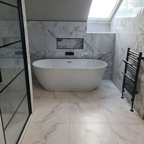 Bathroom with white marble on walls and floors