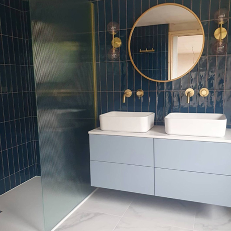Navy Bathroom Tiles with Gold Fixtures