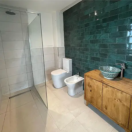 Stylish bathroom tiled in Titan Forest and Traffic Cream