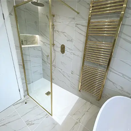 Marble-inspired bathroom with gold accessories