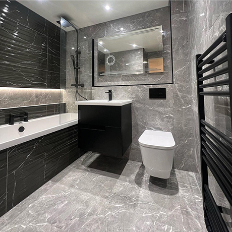 Marble-effect bathroom tiled in B&W Star Black Decor and Kingston Graphite