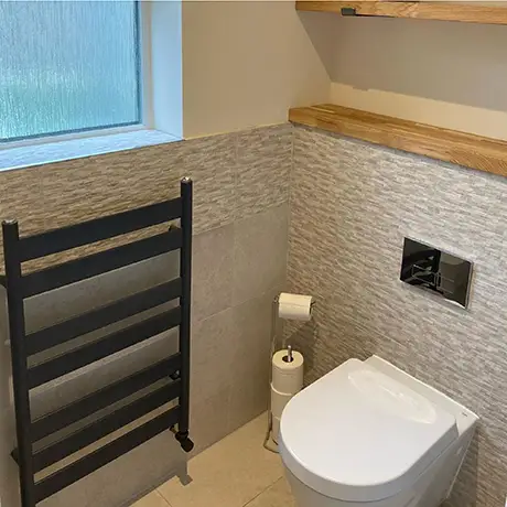 Small bathroom tiled in Knole Cream and Décor