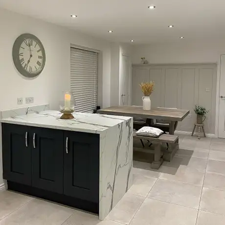 Grey tiled kitchen floor and monochrome units
