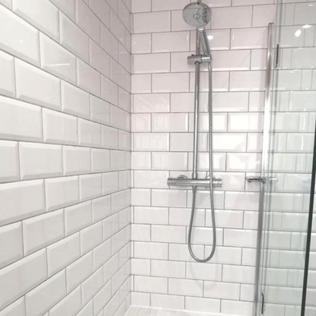 Bevelled patterned white bathroom wall tiles