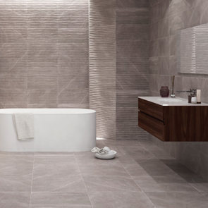 British stone grey wave décor tile in a modern bathroom setting with matching wall and floor tiles