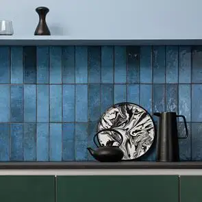 Dyroy blue being used as a kitchen splashback with oak counter tops