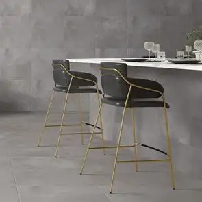 Grey Cementine wall tiles in contemporary kitchen with marble breakfast bar