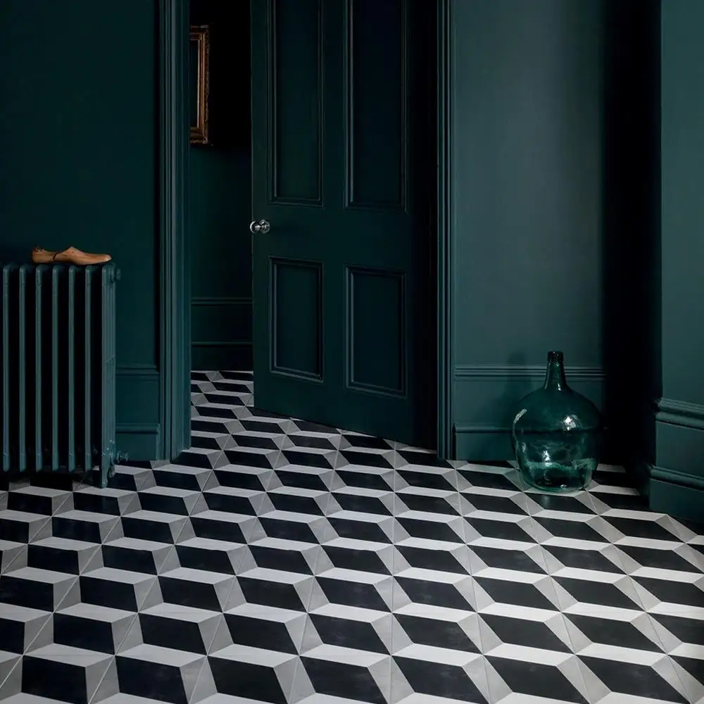 Cuban black block tile being used in a traditional styled hallway with antique green paint