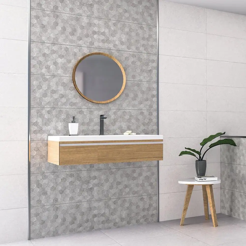 Buxy Gris Hexagon décor tile being used a feature strip in a modern bathroom setting with floating accessories