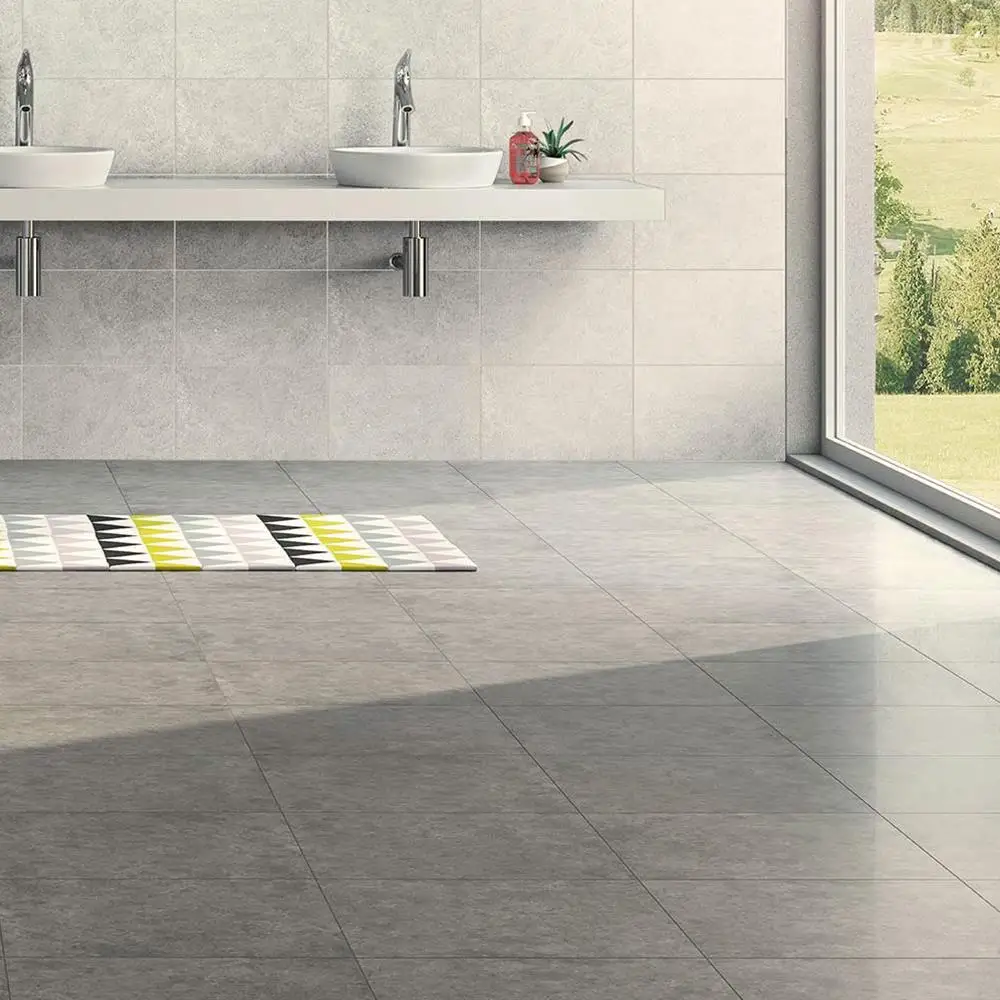 450x450 Dovedale light grey floor tile in a open space with wall hung sinks and modern fixings