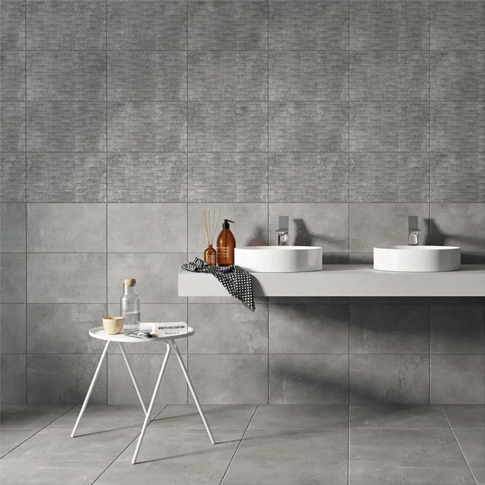 Cairn 2 Smoke Grey ceramic décor tile being used as a 50/50 split in a modern bathroom setting with the matching plain tile