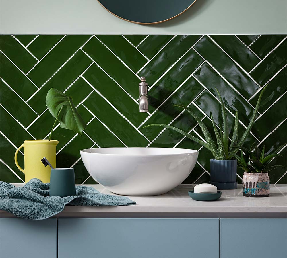 Green herringbone bathroom tiles