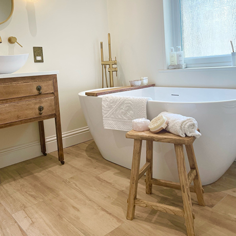 Beige floor tiles in a bathroom setting