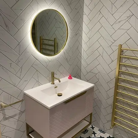 Chic bathroom with Carrara Brick in herringbone layout