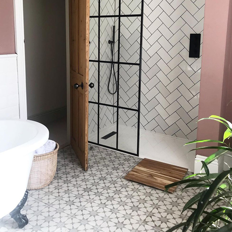 Stylish bathroom scheme with patterned and metro tiles