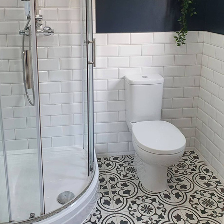 Traditional White Brick and Patterned Bathroom