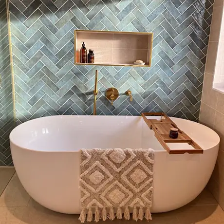 Aqua green and blue herringbone bathroom