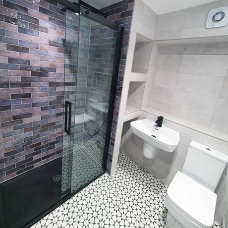 Purple tiled bathroom using Dyroy Aubergine Tiles