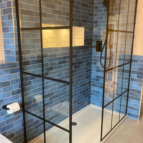Blue Fully Tiled Walk-in Shower with Black Panel Glass in Bathroom