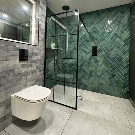 Modern bathroom featuring Dyroy Green in herringbone layout with Dyroy Grey
