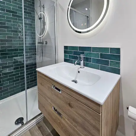 Green tiles in bathroom setting