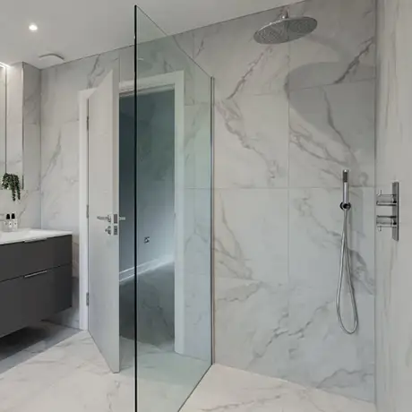 Fully tiled bathroom and walk in shower using marble