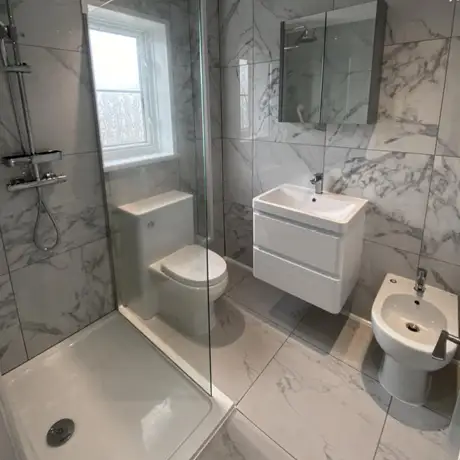 Strong veined marble tiles in shower room