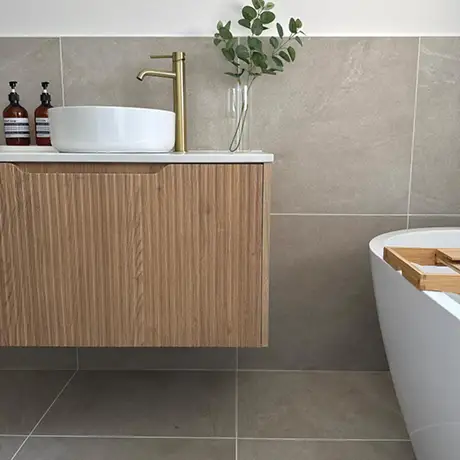 Cream tiles in bathroom setting