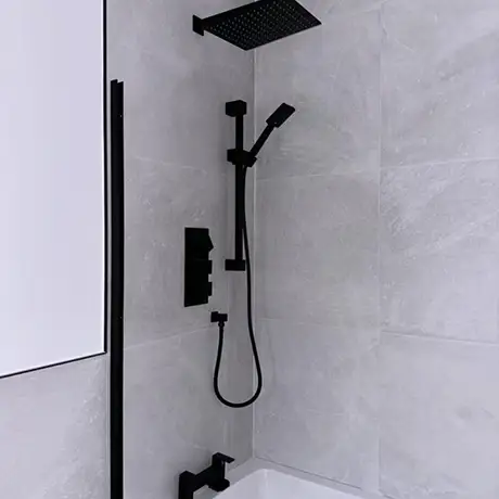 White wall tiles in bathroom with black accessories