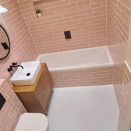 Fully tiled pink bathroom