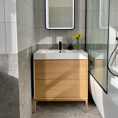 Grey and white bathroom with flower on sink