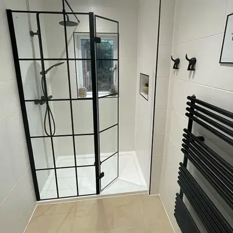 All white bathroom with black features