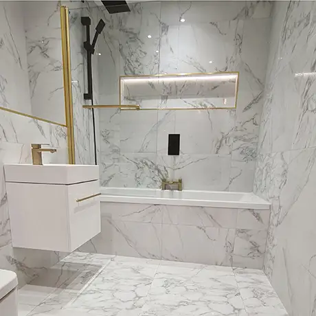 Lassen Carrara and coordinating tiles in a bathroom