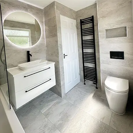 Modern bathroom tiled in Nature Grey