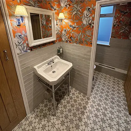 Quirky bathroom tiled in Poitiers White and Cuban Silver Star