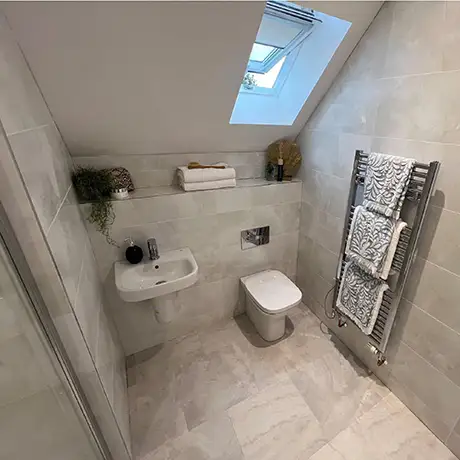 Bathroom with sloped ceiling and Velux window featuring Stoneware Flint