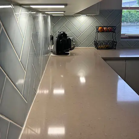 Light green tiles in kitchen setting