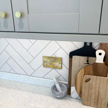 White Tile Splashback in Herringbone Layout