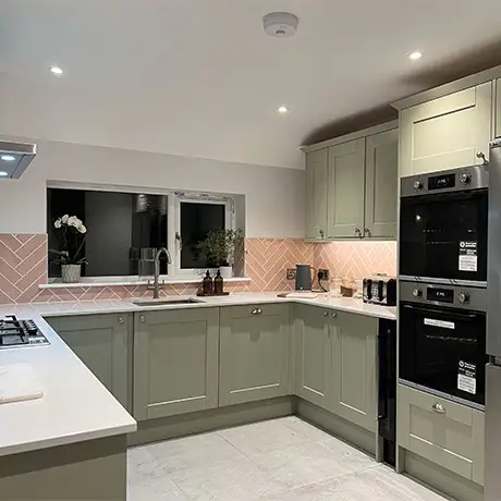 Modern kitchen with Poitiers Rose Pink on the wall and Knole White on the floor