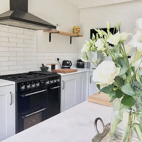 White Shaker Kitchen with Brick Tile Design