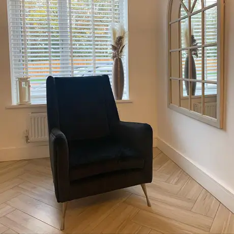 Wood floor tiles in a herringbone pattern