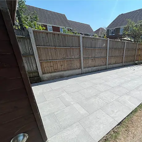 Back garden patio tiled in Veined Stone Dark Greige