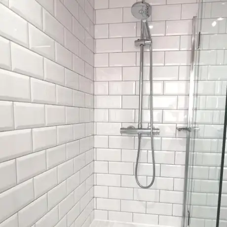 Bevelled patterned white bathroom wall tiles