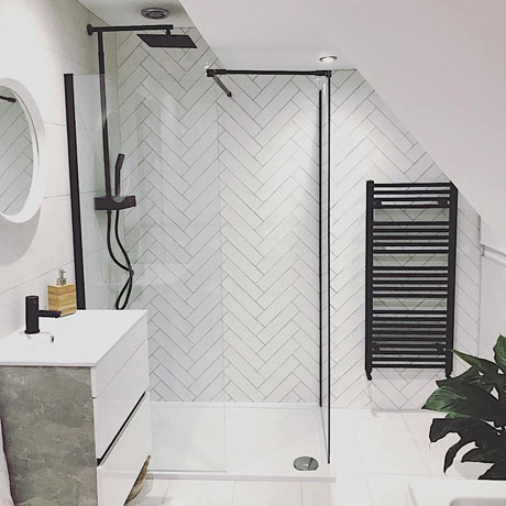Monochrome bathroom with herringbone tiles