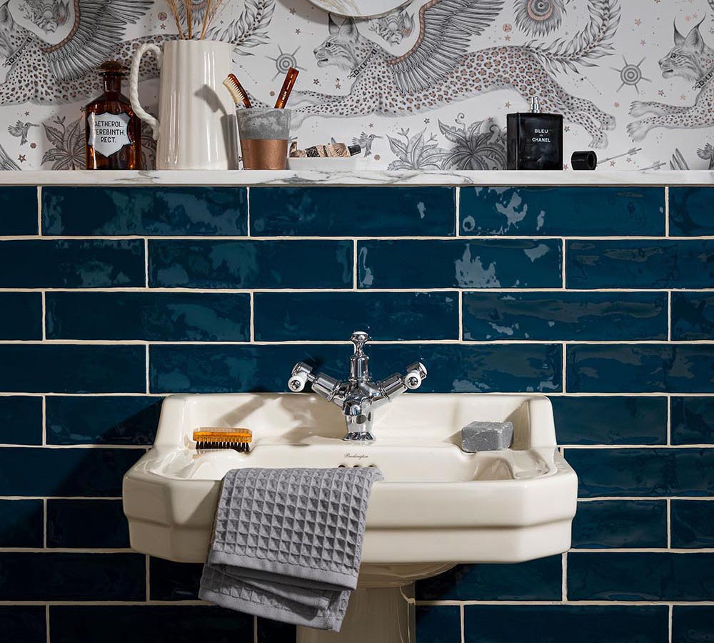 Blue bathroom tiles with wallpaper