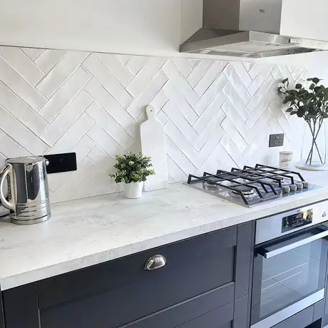 White textured herringbone and navy kitchen