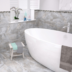 Modern bathroom half tiled in stoneware flint silk tile with freestanding bath and eye catching mosaic border